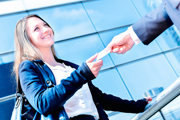 Small Business Owner Exchanging Business Cards